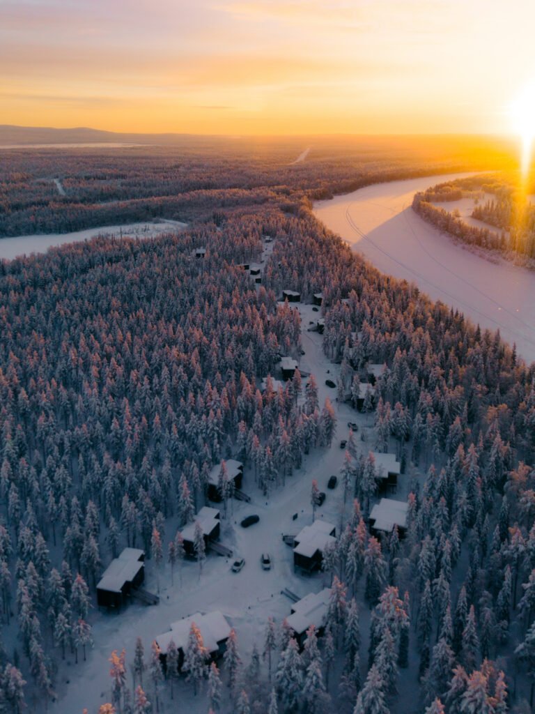 Snow-covered riverside landscape in Finnish Lapland
