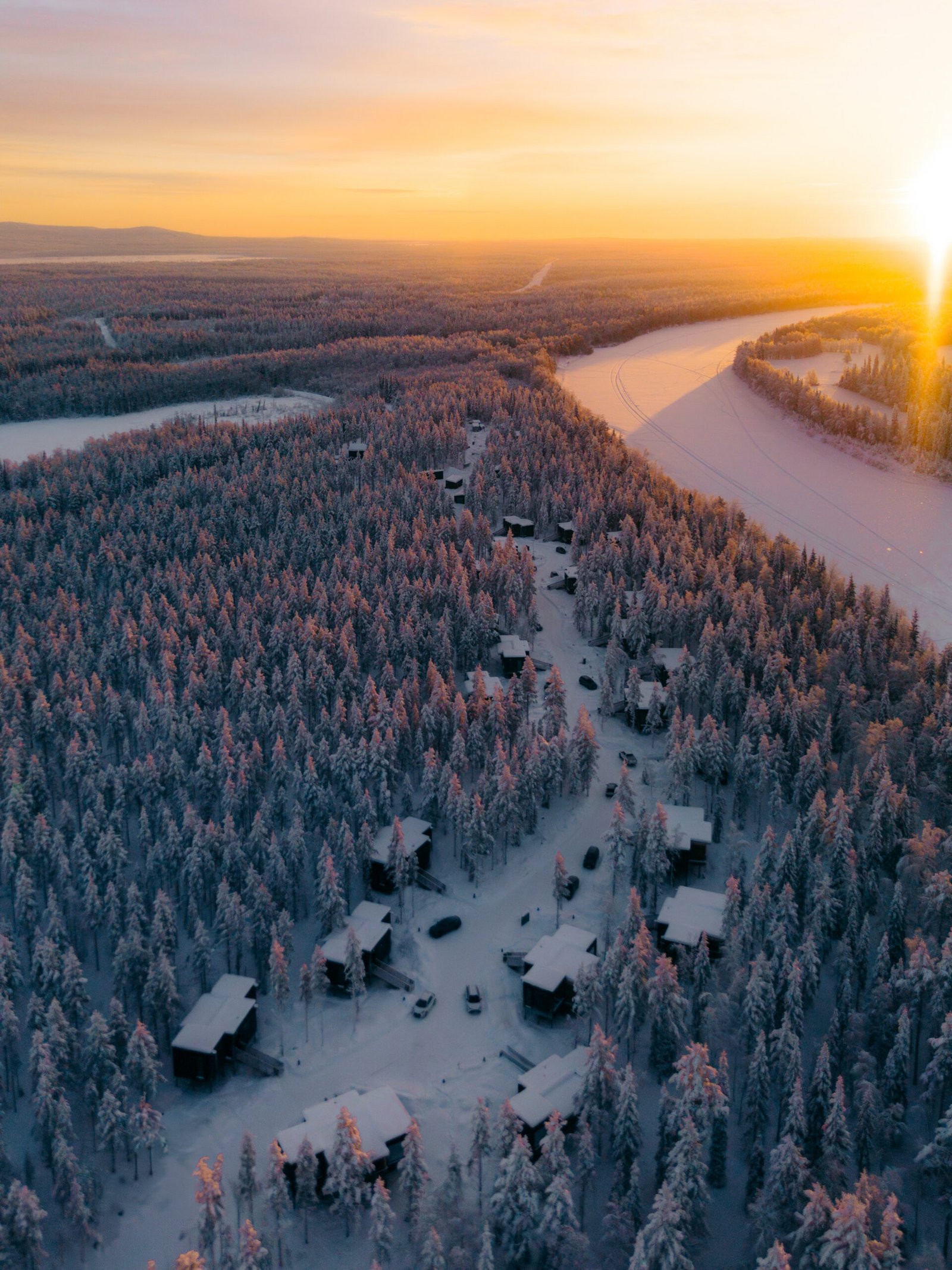 Snow-covered riverside landscape in Finnish Lapland