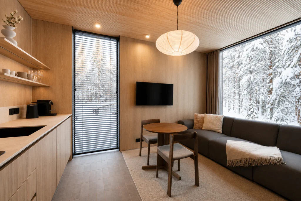 Standard Villa kitchen and living area with timber finishes and forest views.